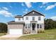 Beautiful two-story home with stone accents and a two-car garage at 1026 Heath Helms Rd, Monroe, NC 28110