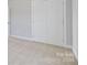 Spacious bedroom closet with double doors and neutral walls at 1026 Heath Helms Rd, Monroe, NC 28110