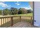 Wooden deck overlooking a grassy backyard with trees at 1026 Heath Helms Rd, Monroe, NC 28110