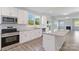 Spacious kitchen with island, white cabinets, and granite countertops at 1026 Heath Helms Rd, Monroe, NC 28110