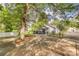 Landscaped backyard with concrete patio at 749 W Brooklyn Ave, Lancaster, SC 29720