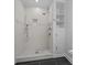 Spa-like shower with multiple shower heads and built-in shelving at 230 S Tryon St # 1101, Charlotte, NC 28202