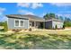 Ranch style home with gray siding and a covered front porch at 1345 Wildflower Dr, Gastonia, NC 28056