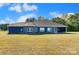 Blue house exterior with large backyard and screened porch at 1345 Wildflower Dr, Gastonia, NC 28056