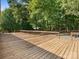 Spacious wooden deck overlooking wooded backyard at 13079 Philadelphia Church Rd, Oakboro, NC 28129