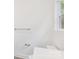 Simple bathroom with toilet and a window, showcasing white walls at 337 Autumn Dr, Harrisburg, NC 28075