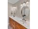 Bathroom with double vanity, large mirror, and neutral tones at 225 Greenway Ave, Cherryville, NC 28021