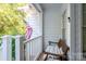 Relaxing porch with bench and view of the surrounding trees at 272 Millingport Ln, New London, NC 28127