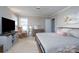 Bedroom with a king-size bed, rocking chair, and built-in shelving at 272 Millingport Ln, New London, NC 28127