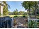 Landscaped backyard with stone path and mature trees at 272 Millingport Ln, New London, NC 28127