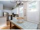 Bright kitchen features white cabinetry, stainless steel appliances, and hardwood floors at 272 Millingport Ln, New London, NC 28127