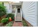 Front entrance with steps and brick walkway at 272 Millingport Ln, New London, NC 28127