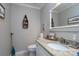 Charming bathroom with granite countertop and decorative mirror at 272 Millingport Ln, New London, NC 28127