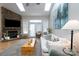 Spacious living room with stone fireplace, high ceilings, and lots of natural light at 272 Millingport Ln, New London, NC 28127