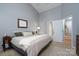 King bedroom with ensuite access and neutral decor at 272 Millingport Ln, New London, NC 28127