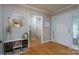 Bright and spacious entryway with hardwood floors and a view of the living room at 272 Millingport Ln, New London, NC 28127