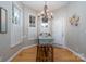 Charming dining area with chandelier and built-in shelving at 272 Millingport Ln, New London, NC 28127