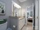 Clean bathroom with granite countertops and a view into a bedroom at 272 Millingport Ln, New London, NC 28127