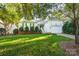 White house with green shutters and a two-car garage at 272 Millingport Ln, New London, NC 28127