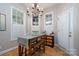 Bright dining area with rustic table and bench seating at 272 Millingport Ln, New London, NC 28127