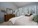 Main bedroom with a king-size bed, dresser, and access to a private patio at 272 Millingport Ln, New London, NC 28127