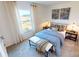 Bedroom with blue bedding and bench at foot of bed at 1003 Farm Branch Ct, Indian Trail, NC 28079