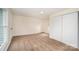 Well-lit bedroom with window, closet, and neutral walls at 107 Maurice St, Monroe, NC 28112