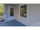 Renovated front porch with a new door and window at 211 Maple St, Shelby, NC 28150