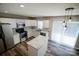 Modern kitchen with stainless steel appliances and white cabinets at 5204 Holbert Cir, Charlotte, NC 28269