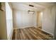 Bright dining room with hardwood floors and a modern light fixture at 5204 Holbert Cir, Charlotte, NC 28269