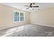 Bright bedroom with carpet, large window, and ceiling fan at 2720 Lentz Rd, China Grove, NC 28023