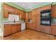 Kitchen features wood cabinets, double oven, and hardwood floors at 2720 Lentz Rd, China Grove, NC 28023