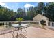 Wooden deck with small table, offering backyard views at 2720 Lentz Rd, China Grove, NC 28023