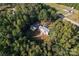 Aerial view showcasing house, detached garage, and yard at 2720 Lentz Rd, China Grove, NC 28023