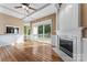 Spacious living room features hardwood floors, fireplace, and sliding glass doors leading to deck at 2720 Lentz Rd, China Grove, NC 28023