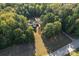 House nestled in a wooded area, seen from above at 2720 Lentz Rd, China Grove, NC 28023
