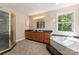 Bathroom with double vanity, shower, and tub at 2720 Lentz Rd, China Grove, NC 28023