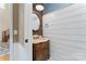 Powder room with wood vanity and shiplap walls at 2720 Lentz Rd, China Grove, NC 28023