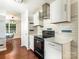 Modern kitchen with white cabinets, stainless steel appliances, and subway tile backsplash at 4838 Elizabeth St, Charlotte, NC 28269