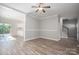 Bright living room with hardwood floors and access to deck at 128 Inverness Loop, Mooresville, NC 28117