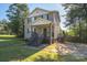 Two-story house with gray siding and a front porch at 128 Inverness Loop, Mooresville, NC 28117