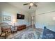 Bedroom with double doors, ceiling fan, and wood storage chest at 2014 Newstyle Way, Tega Cay, SC 29708