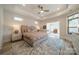Large main bedroom with sitting area and access to bathroom at 2014 Newstyle Way, Tega Cay, SC 29708