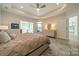 Bright main bedroom with access to a sunroom and kitchen at 2014 Newstyle Way, Tega Cay, SC 29708