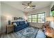 Cozy bedroom with a sofa, armchair, and large windows at 2014 Newstyle Way, Tega Cay, SC 29708