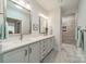 Double vanity bathroom with a large shower at 2014 Newstyle Way, Tega Cay, SC 29708