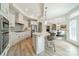 Modern kitchen with white cabinets and island at 2014 Newstyle Way, Tega Cay, SC 29708