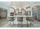 Open concept kitchen with white cabinets and island at 2014 Newstyle Way, Tega Cay, SC 29708