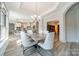 Bright dining room with kitchen and library access at 2014 Newstyle Way, Tega Cay, SC 29708