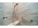 Walk-in shower with tiled walls and built-in seat at 2014 Newstyle Way, Tega Cay, SC 29708